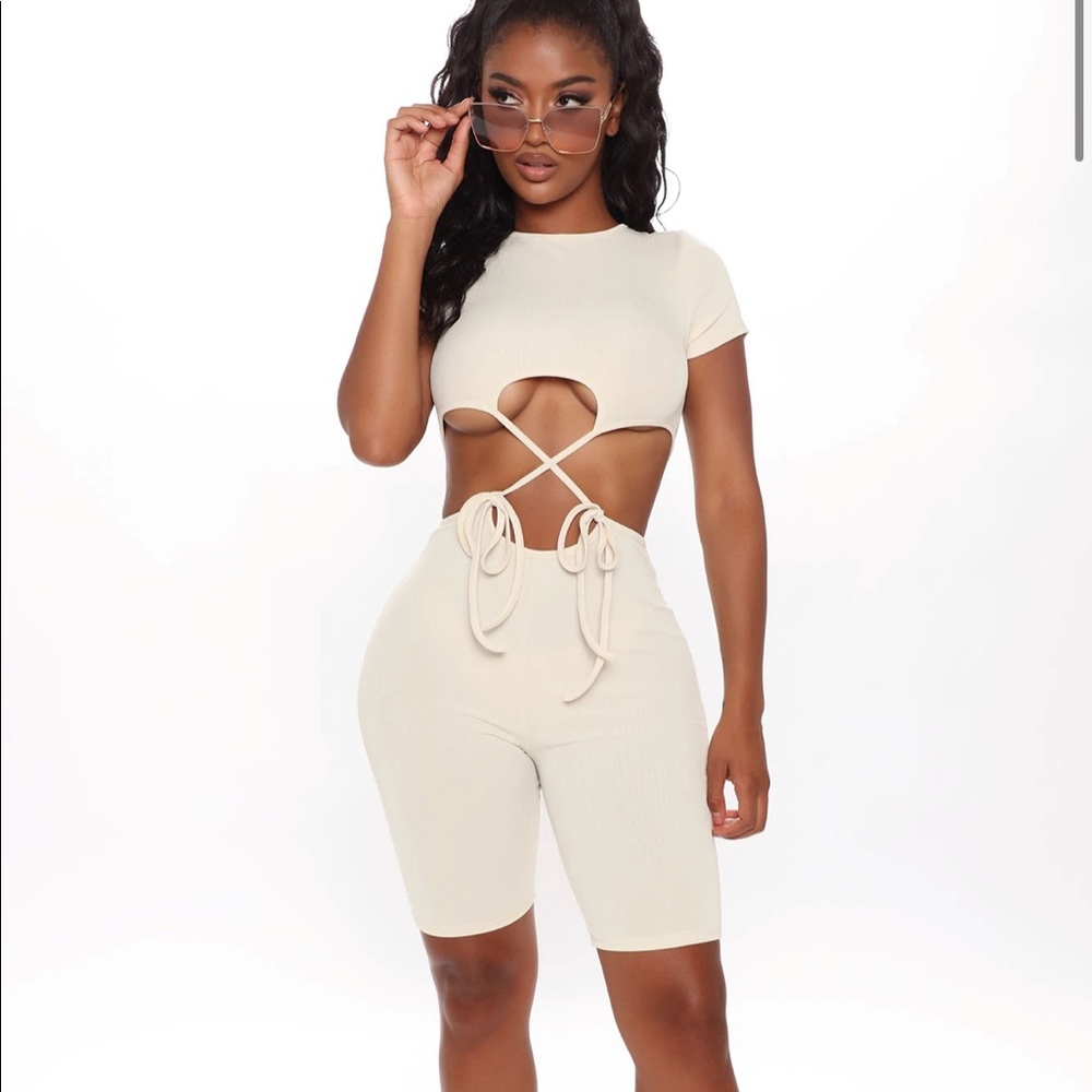 Fashion nova tan cut out jumpsuit. Size small, very stretchy. Ties in front.